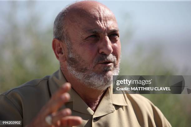 Sixty years old Ayhan Ankurt, who campaigned to get the mosque built, speaks during an interview in front of Hala Sultan mosque in Haspolat , in the...