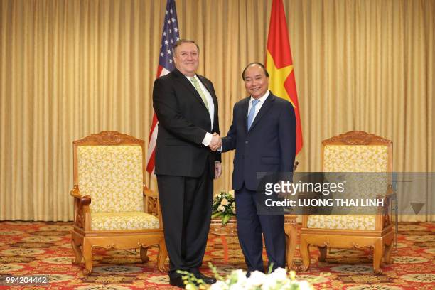 Secretary of State Mike Pompeo shakes hands with Vietnam's Prime Minister Nguyen Xuan Phuc during their meeting at the International Convention...