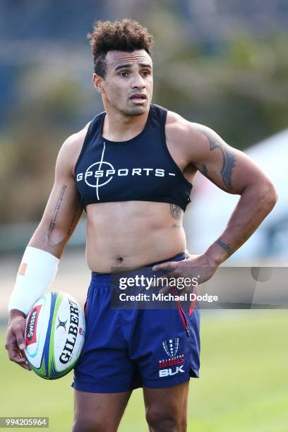 Will Genia of the Rebels, wearing a cast on his injured arm, looks ahead while taking part in his fitness test during a Melbourne Rebels Super Rugby...