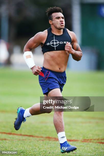 Will Genia of the Rebels, wearing a cast on his injured arm, runs while taking part in his fitness test during a Melbourne Rebels Super Rugby...