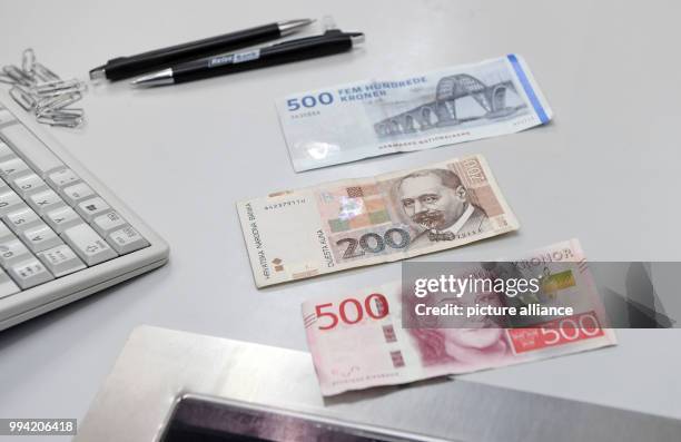 Notes of different European currencies , Danish Krone, Croatian Kuna and Swedish Krona, can be seen at a exchange office in Munich, Germany, 13...