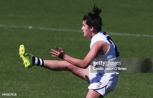 Vic Country's Lucy Mcevoy kicks a goal during the AFLW U18 Championships match between Queensland and Vic Country at Metricon Stadium on July 9, 2018...