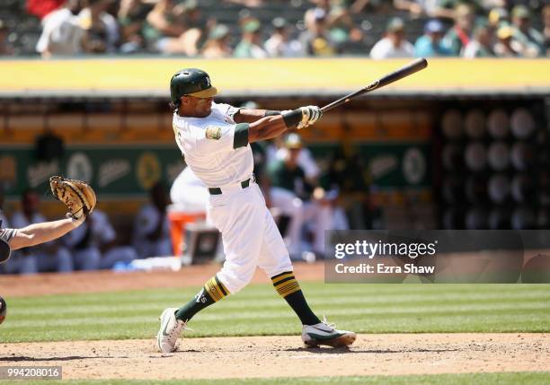 Khris Davis of the Oakland Athletics bats against the Houston Astros at Oakland Alameda Coliseum on June 14, 2018 in Oakland, California.