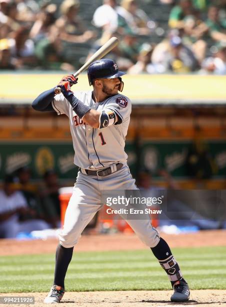 Carlos Correa of the Houston Astros bats against the Oakland Athletics at Oakland Alameda Coliseum on June 14, 2018 in Oakland, California.