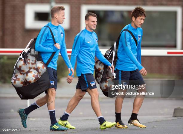 Hertha's Ondrej Duda , Vladimir Darida and Genki Haraguchi arrive for a training session before the Europa League Group Stage match between Hertha...