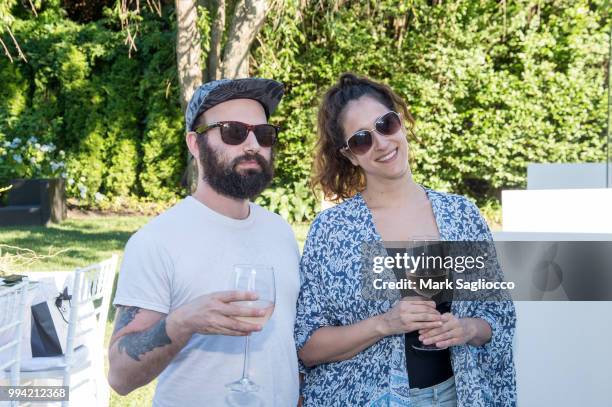 Mike Musikanto and Michelle Musikanto attend the Hamptons Magazine Cover Star Rose Byrne Celebration Presented By Lalique Along With Maddox Gallery...