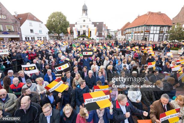 The crowd waits from German chancellor Merkel during an election campaign event on the market place of Lingen, Germany, 13 September 2017. A signr...