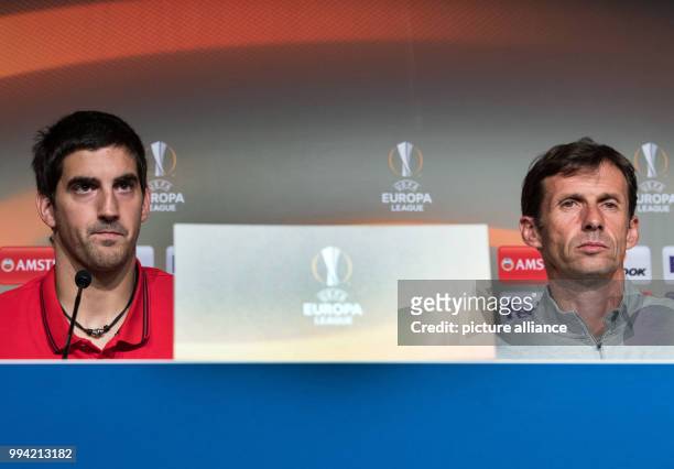 The head coach of Bilbao Jose Angel Ziganda and player Mikel San José speak to journalists during a press conference regarding the Europa League...