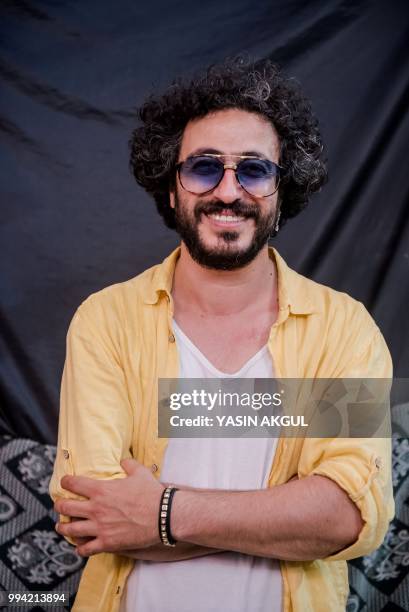 Turkish traditional musician and conductor Hakan Gungor poses for a picture during a rehearsal ahead of the 46th edition of Istanbul Music Festival...