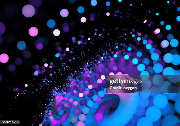 abstract swirl with polka dots on black background - abstract light swirl stock pictures, royalty-free photos & images