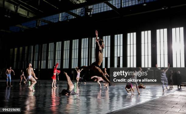 Dpatop - Members of the Ensembles Musée de la danse perform a scene from "A Dancer's Day / 10000 Gestures" by Boris Charmatz at the former airport...