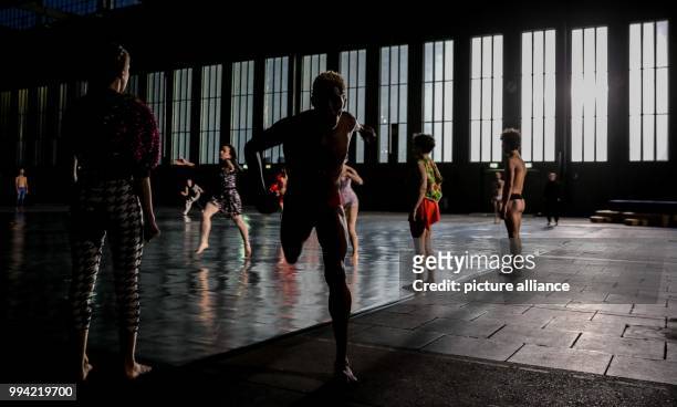 Members of the Ensembles Musée de la danse perform a scene from "A Dancer's Day / 10000 Gestures" by Boris Charmatz at the former airport Tempelhof...