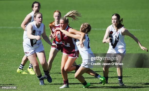 Queensland's Dee Heslop in action during the AFLW U18 Championships match between Queensland and Vic Country at Metricon Stadium on July 9, 2018 in...