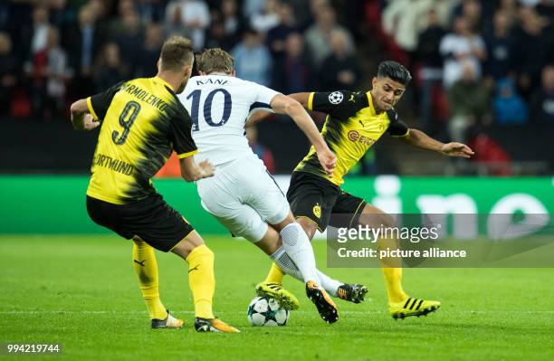 Dortmund's Andrej Jarmolenko and Mahmoud Dahoud as well as Harry Kane of Tottenham vie for the ball during the Champions League Group Phase Match...