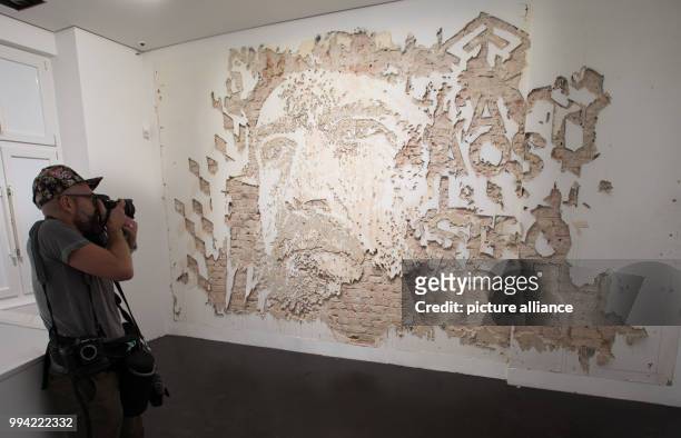 Work by Portuguese urban artist Vhils on display in the Urban Nation Museum For Comtemporary Art in Berlin, Germany, 14 September 2017. The museum...