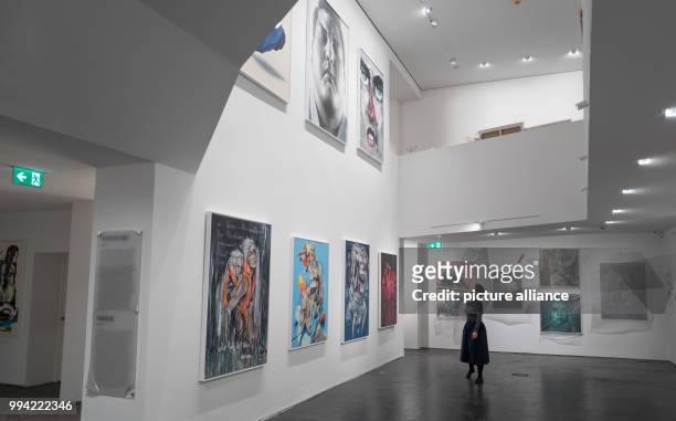 Woman walks past work on display in the Urban Nation Museum For Comtemporary Art in Berlin, Germany, 14 September 2017. The museum opens on the 16...