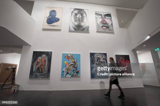 Woman walks past work on display in the Urban Nation Museum For Comtemporary Art in Berlin, Germany, 14 September 2017. The museum opens on the 16...
