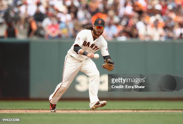 Brandon Crawford of the San Francisco Giants fields a ground ball against the St. Louis Cardinals at AT&T Park on July 7, 2018 in San Francisco,...