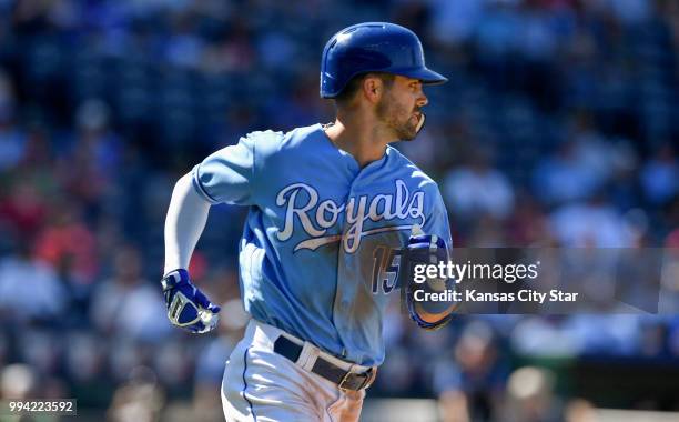 Kansas City Royals' Whit Merrifield runs to first on an RBI single to score Adalberto Mondesi in the ninth inning during Sunday's baseball game...