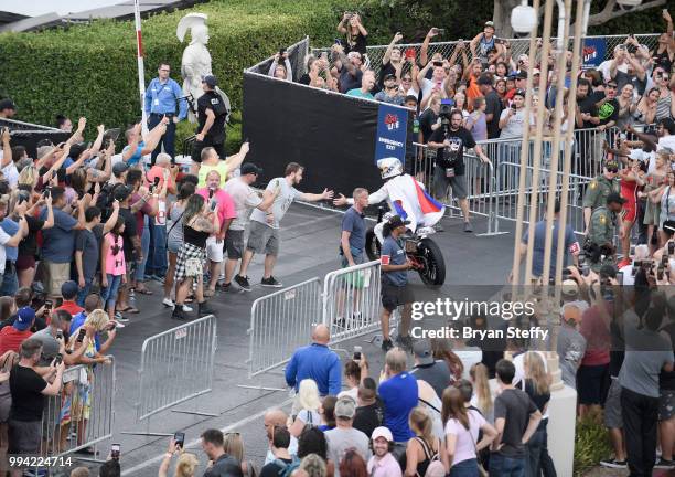 Travis Pastrana rides through the crowd during HISTORY's Live Event 'Evel Live' at Omnia Nightclub at Caesars Palace on July 8, 2018 in Las Vegas,...