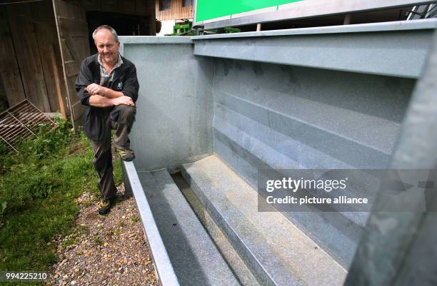 Farmer Herbert Siegel sits on his mobile slaughtering station in Missen, Germany, 21 August 2017. The station allows Siegel to slaughter his cows in...