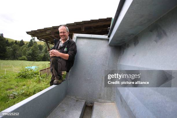 Farmer Herbert Siegel sits on his mobile slaughtering station in Missen, Germany, 21 August 2017. The station allows Siegel to slaughter his cows in...