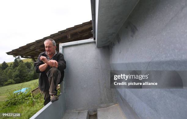 Farmer Herbert Siegel sits on his mobile slaughtering station in Missen, Germany, 21 August 2017. The station allows Siegel to slaughter his cows in...
