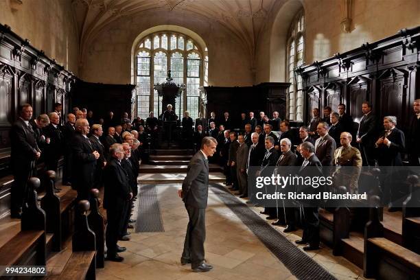 British actor Jeremy Irons as mathematician G. H. Hardy in the biographical film 'The Man Who Knew Infinity', 2015. On the right, in uniform, is Toby...