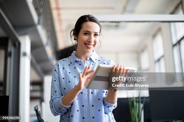 portrait of smiling businesswoman using tablet - technophile stock pictures, royalty-free photos & images