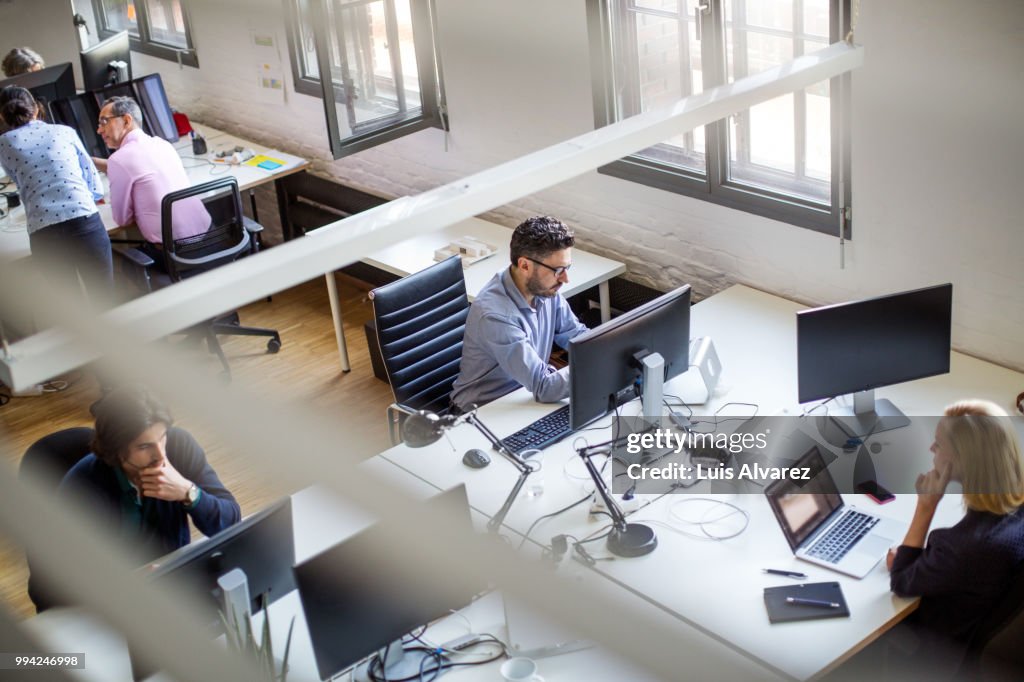 Programmers Using Computers At Creative Office High-Res Stock Photo ...
