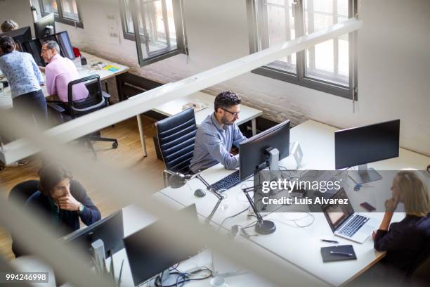 programmers using computers at creative office - beautiful laptop on desk stock pictures, royalty-free photos & images