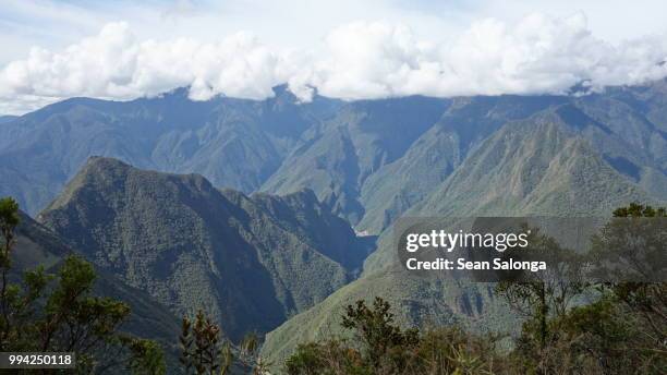 mountains surrounding aguas calientes - calientes stock pictures, royalty-free photos & images