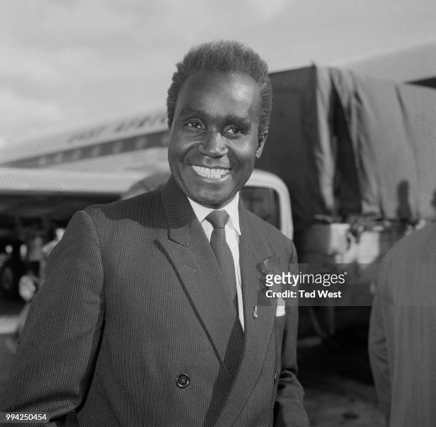 Kenneth Kaunda, the Prime Minister of Northern Rhodesia , arrives at London Airport for talks at Marlborough House, 1st May 1964. The topic of...