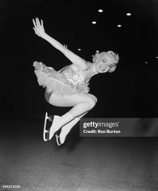 American roller skater and ice skater Gloria Nord rehearses for the ice pantomime 'Humpty Dumpty' at Wembley in London, 4th December 1953. She plays...