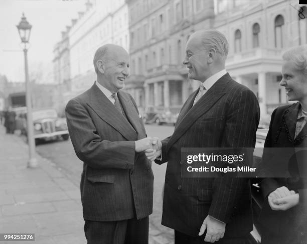 Frederick Doidge , the New Zealand High Commissioner to the UK, bids farewell to Lieutenant-General Sir Willoughby Norrie outside the latter's hotel...