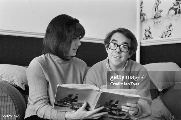 Scottish actor and comedian Ronnie Corbett and his wife, actress Anne Hart study a book on Italian cookery, January 1969.