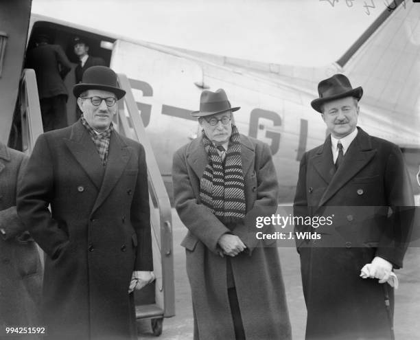 British Conservative politician Alfred Duff Cooper , the British Ambassador to France, with French Prime Minister Léon Blum and René Massigli , the...