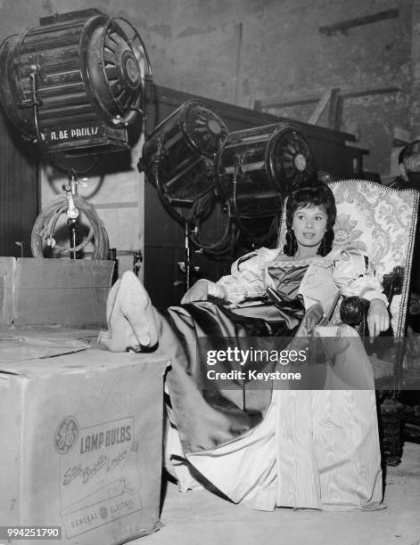 French actress Magali Noël relaxes on the set of the film 'Il colpo segreto di D'Artagnan' in Rome, Italy, 26th April 1962. She plays Carlotta in the...