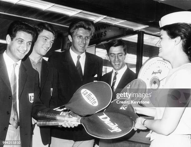 From left to right, French tennis players Pierre Darmon, Pierre Barthès, Jean-Noël Grinda and François Jauffret leave Orly Airport near Paris,...