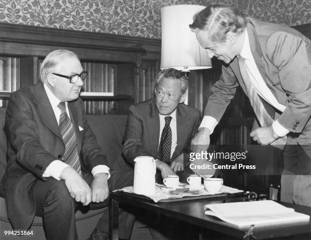 Lee Kuan Yew , the Prime Minister of Singapore, takes coffee with former British Prime Minister and Leader of the Opposition James Callaghan and...