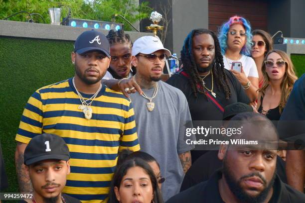Singer Jacquees and Chris Brown attend The 4th of July Day Party at Compound on July 4, 2018 in Atlanta, Georgia.