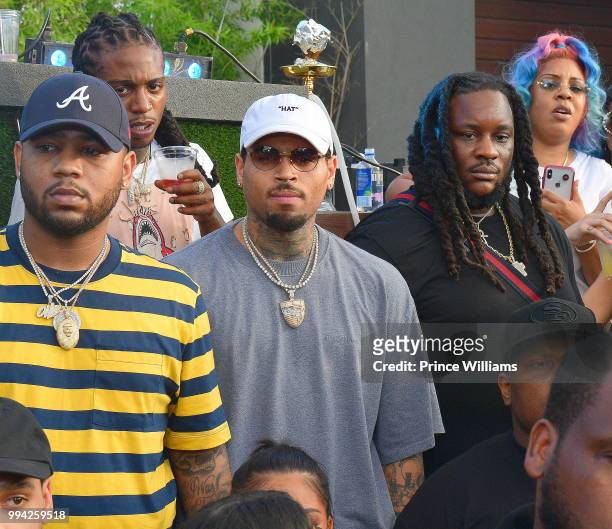 Singer Jacquees and Chris Brown attend The 4th of July Day Party at Compound on July 4, 2018 in Atlanta, Georgia.