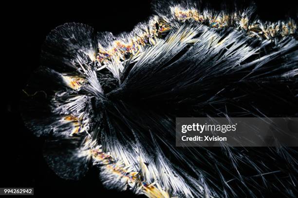 sodium arsenate crystal under polarized light - polarizer stock pictures, royalty-free photos & images