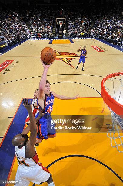 David Lee of the New York Knicks goes up for a shot against Anthony Tolliver of the Golden State Warriors during the game at Oracle Arena on April 2,...