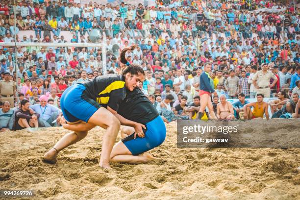 women wrestlers fight kushti at shoolini fair in solan, himachal pradesh. - gawrav stock pictures, royalty-free photos & images