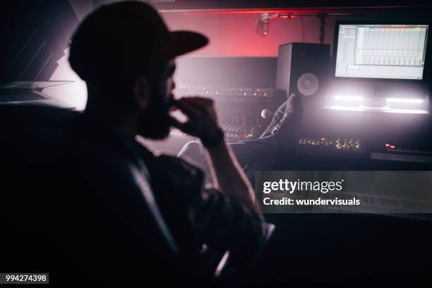 professional music producer having a break in recording studio - waveform monitor stock pictures, royalty-free photos & images