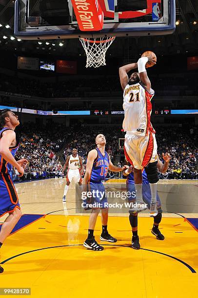 Ronny Turiaf of the Golden State Warriors dunks against Sergio Rodriguez of the New York Knicks during the game at Oracle Arena on April 2, 2010 in...