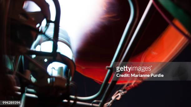 the burner adding hot air to the envelope - fun northern territory stock pictures, royalty-free photos & images