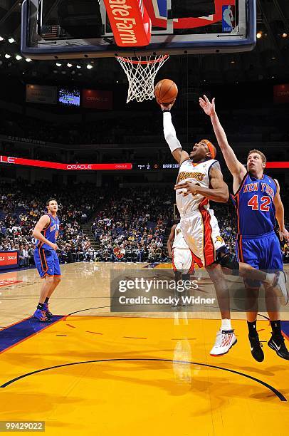 Corey Maggette of the Golden State Warriors shoots a layup against David Lee of the New York Knicks during the game at Oracle Arena on April 2, 2010...