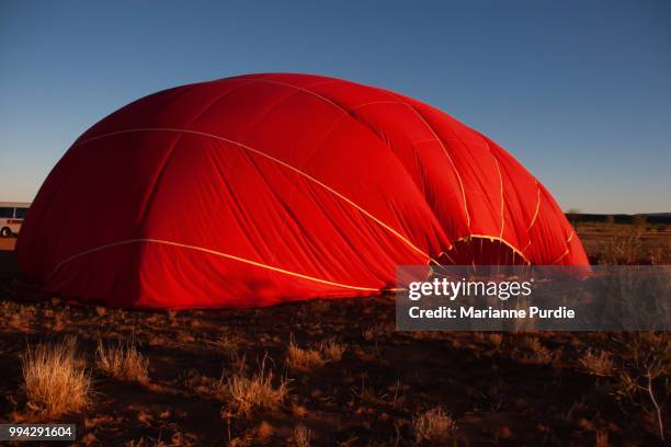 hot air balloon deflating after a flight - fun northern territory stock pictures, royalty-free photos & images